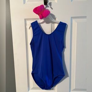 Blue leotard with hot pink headband and wrist bands